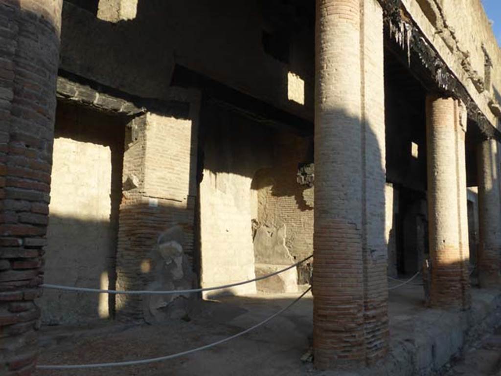 Decumanus Maximus, Herculaneum, September 2015. 
Building on north side of the Decumanus Maximus, doorways numbered 2 and 3, under portico.
The portico protected the front of the large house on the north side.
A programma was found on this brick portico bearing the name of Marcus Caecilius Potitus.
See Wallace-Hadrill, A. (2011). Herculaneum, Past and Future. London, Frances Lincoln Ltd., (p.291).
