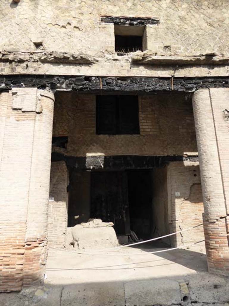 Decumanus Maximus, Herculaneum, October 2014. Building on north side of the Decumanus Maximus, doorway to shop numbered 4. Photo courtesy of Michael Binns.