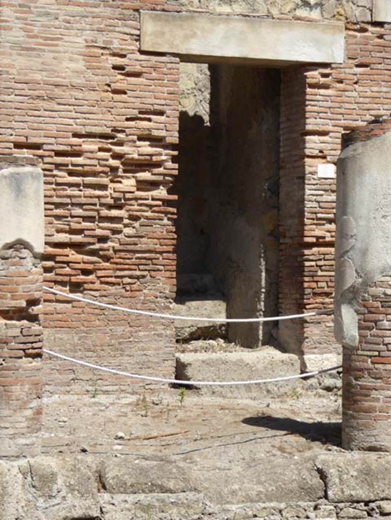 Decumanus Maximus, Herculaneum, July 2015. Building on north side of the Decumanus Maximus, doorway numbered 9.