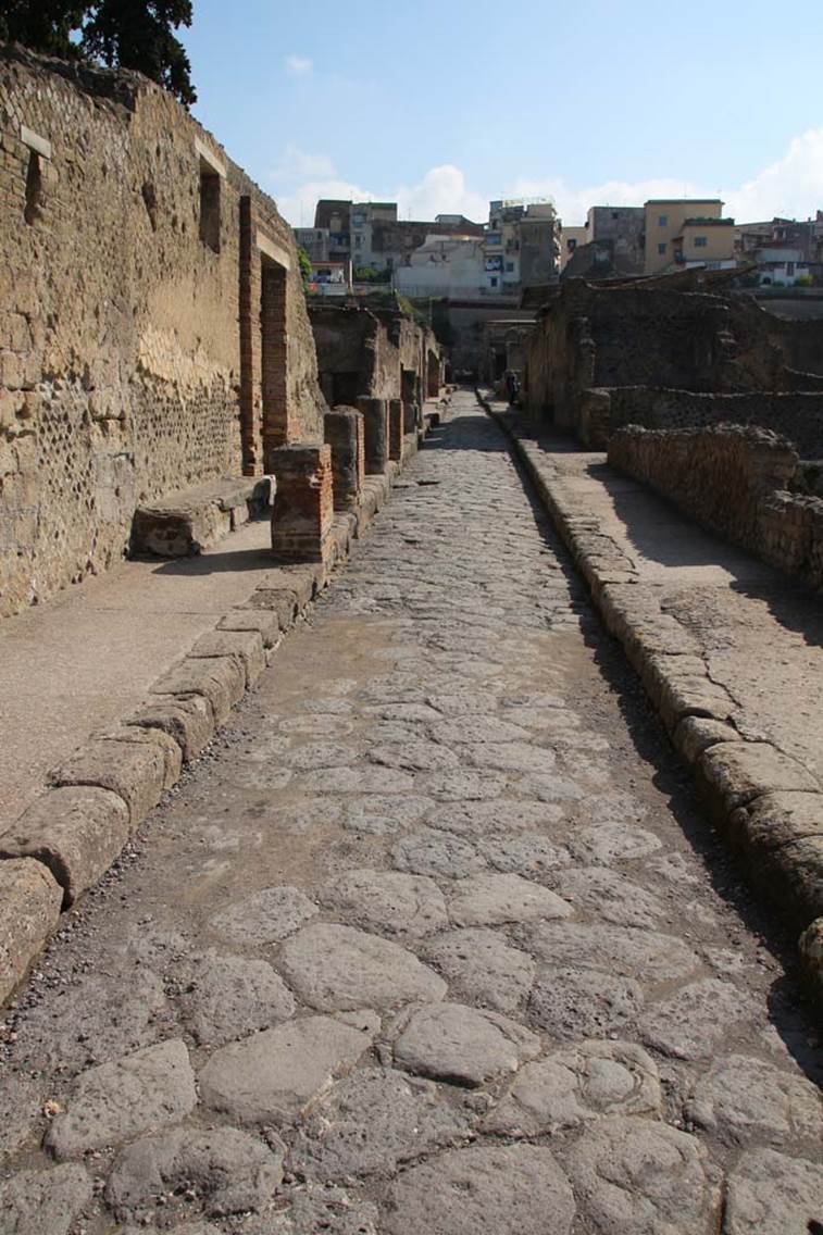 II.2 Herculaneum, April 2014.
Looking north on Cardo III Inferiore towards doorway with benches on either side of it.
Photo courtesy of Klaus Heese.