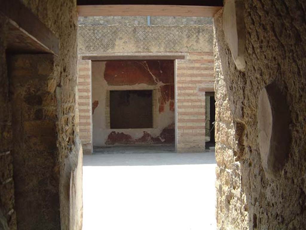 III.3 Herculaneum, May 2001. Looking east from entrance corridor towards atrium.
The doorway to the room on north side of corridor, is on the left. Photo courtesy of Current Archaeology.