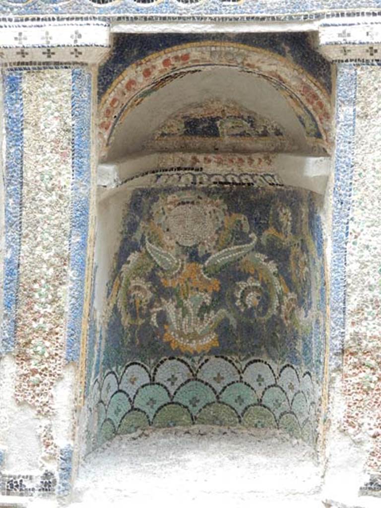 III.3 Herculaneum, May 2018. Detail of niche of mosaic and shell-trimmed aedicula. 
Photo courtesy of Buzz Ferebee.
