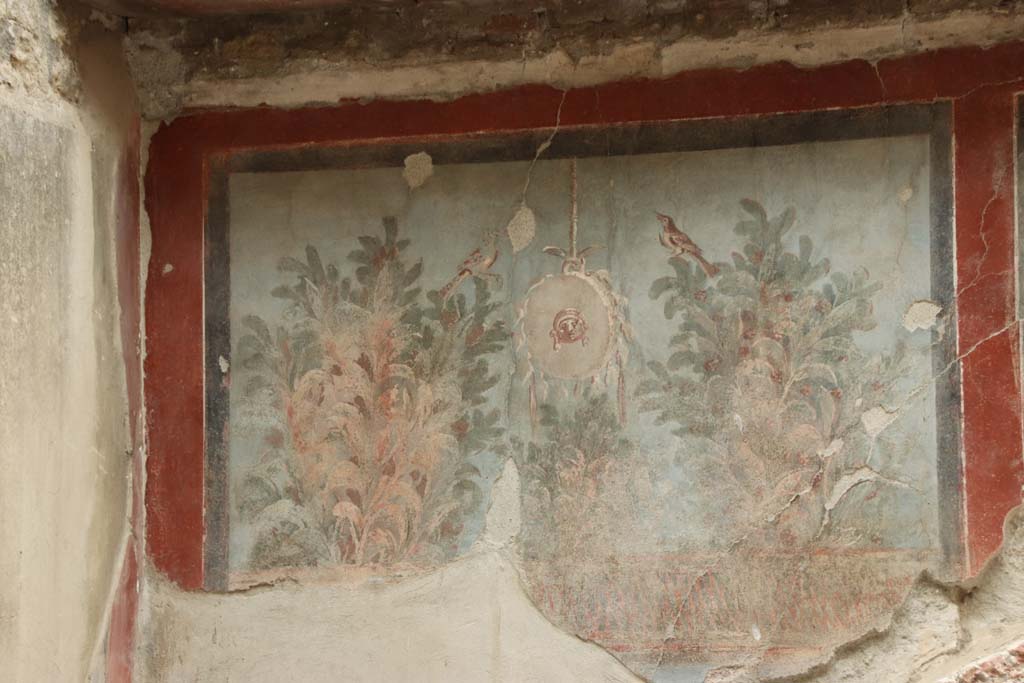 III.3, Herculaneum, September 2019. Garden painting at east end of south wall above nymphaeum. 
Photo courtesy of Klaus Heese.
