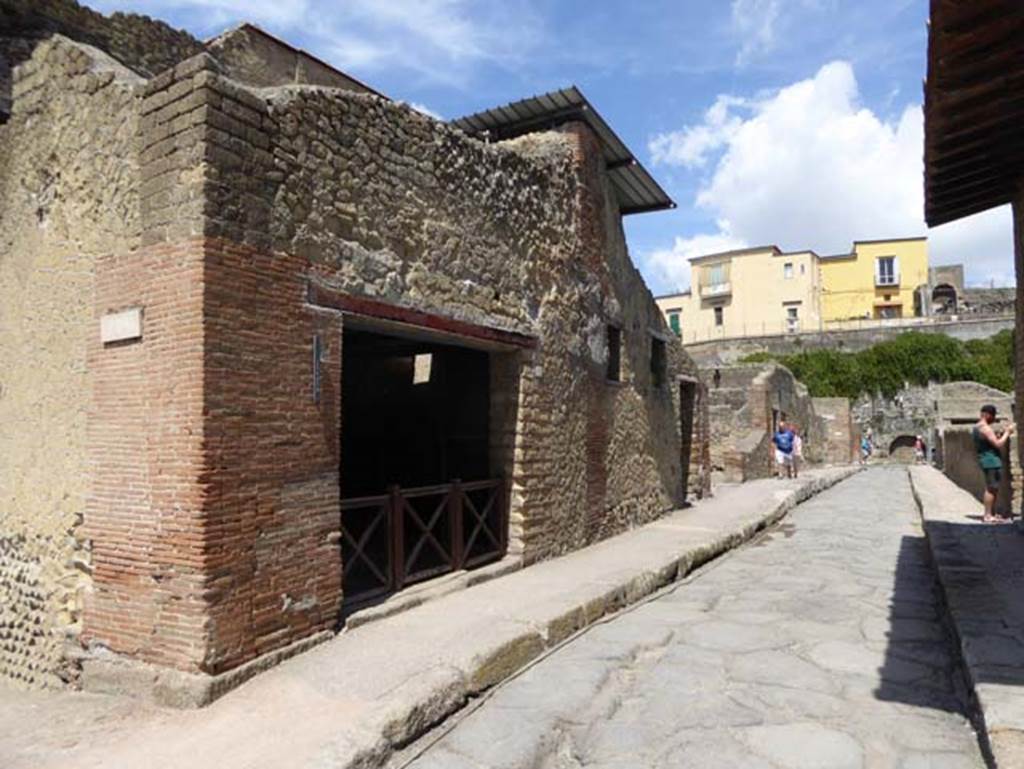 III.10, on left, Herculaneum, September 2015. Looking west along Decumanus Inferiore, from junction with Cardo IV. Photo courtesy of Michael Binns.