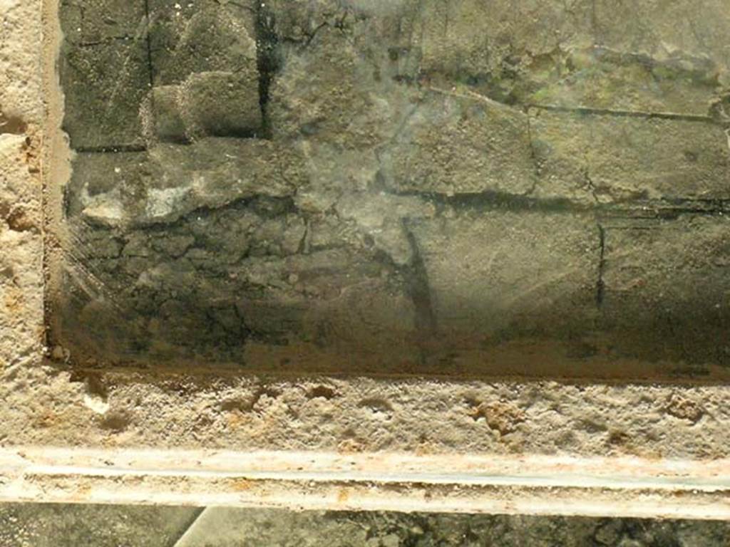 III.10, Herculaneum, May 2005. Press, with carbonised wood. Photo courtesy of Nicolas Monteix.