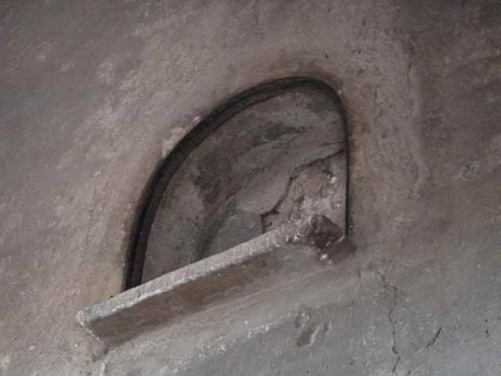 III.11 Herculaneum. May 2010. Room 3, arched niche in west wall of upper floor.