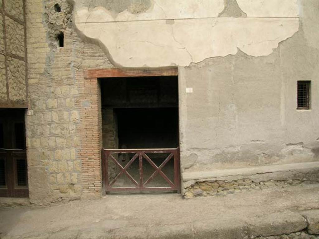 III.12 Herculaneum. June 2006. Looking towards doorway in façade on west side of Cardo IV. Photo courtesy of Nicolas Monteix.