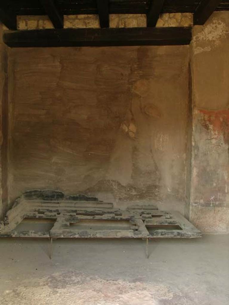 III.13, Herculaneum. April 2005. Looking towards west wall and carbonised wooden bed. Photo courtesy of Nicolas Monteix.