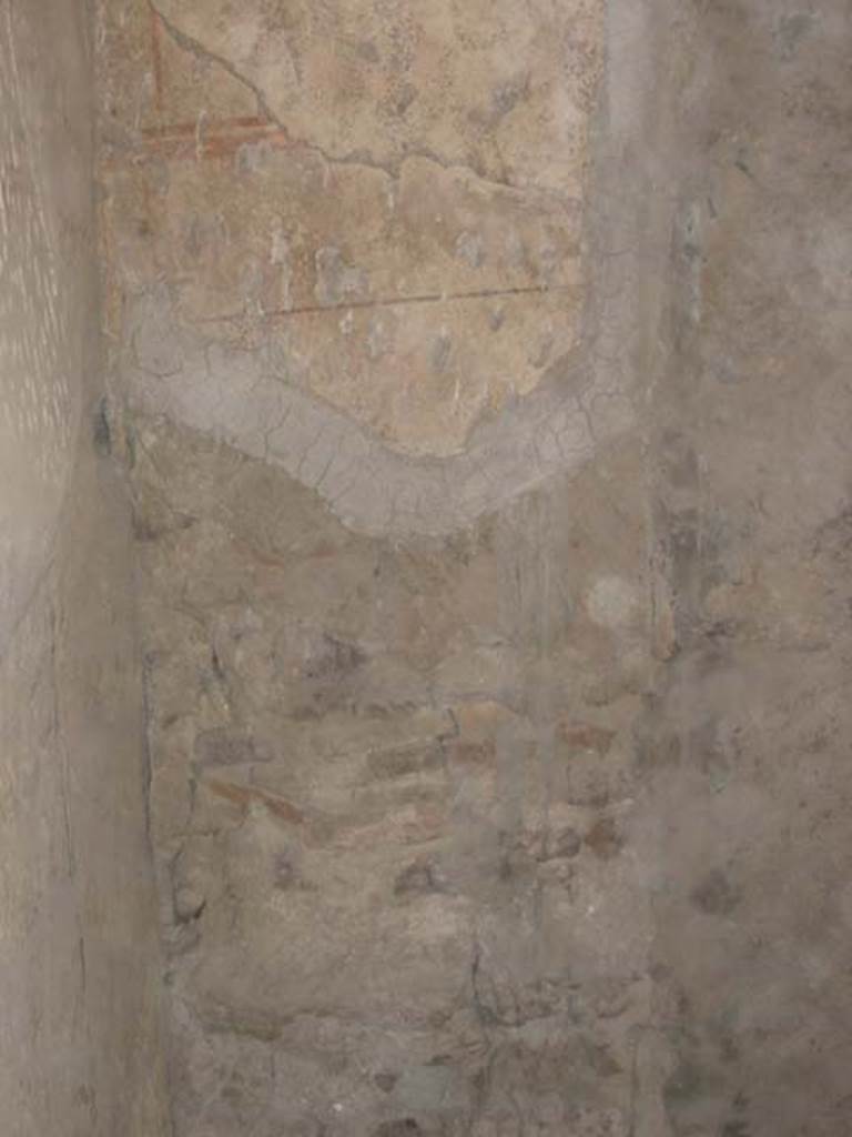 III 15, Herculaneum, May 2003.
Painted decoration on south end of west wall of shop room. Photo courtesy of Nicolas Monteix.