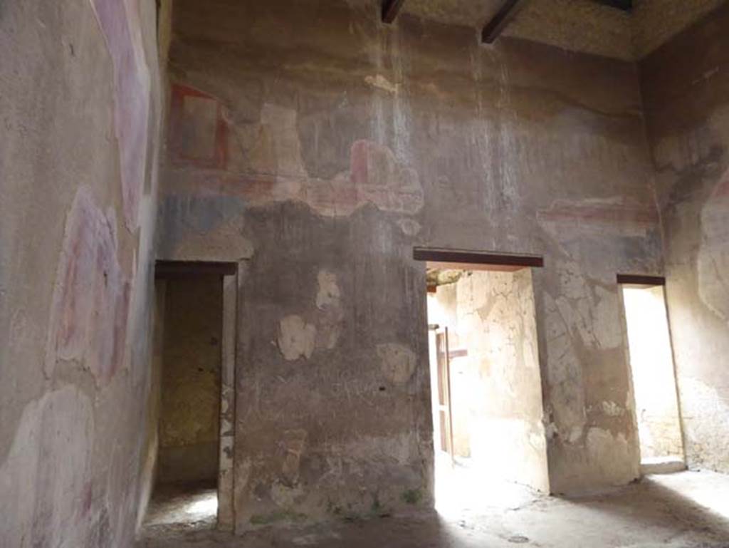 III.16, Herculaneum, October 2014. Room 9, east wall of atrium, with doorway to room 3 in north-east corner, on left.  Photo courtesy of Michael Binns.
