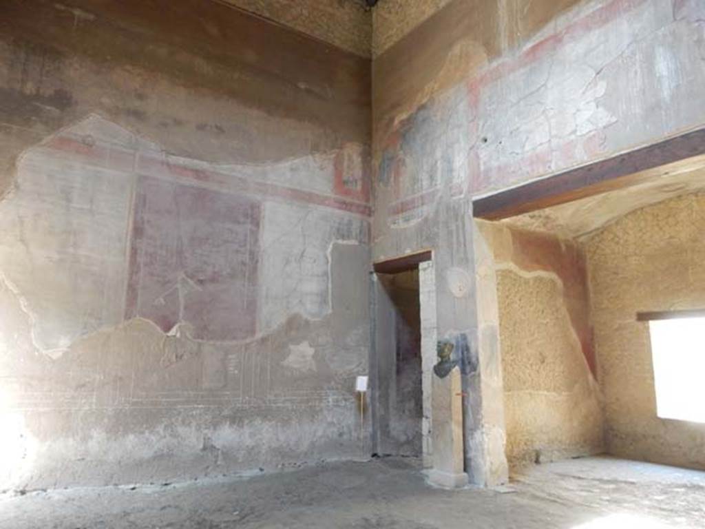 III.16, Herculaneum, May 2018. Room 9, looking towards south wall of atrium, with corridor 6, centre, and tablinum, on right. 
Photo courtesy of Buzz Ferebee
