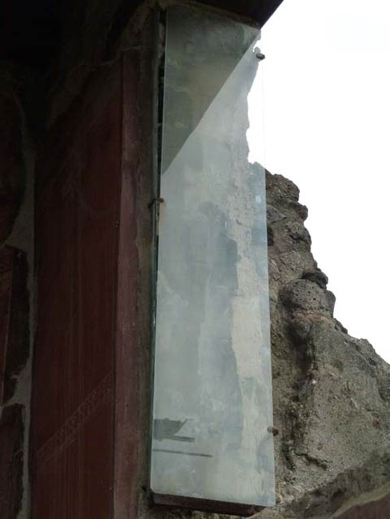 IV.4 Herculaneum. September 2015. Courtyard 3, detail of protection on north side of window in east wall. 
