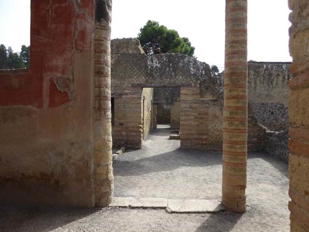 IV.4, Herculaneum, October 2014. Courtyard 3, east wall, looking east across open courtyard 6. Photo courtesy of Michael Binns.
