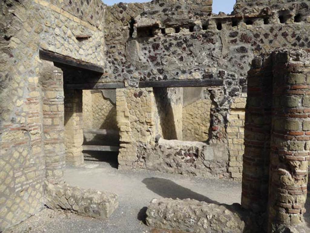 IV.4, Herculaneum, October 2014. Doorway to room 13, on left, and window to room 14, centre right, taken across corridor 11, from courtyard 12.  Photo courtesy of Michael Binns.
