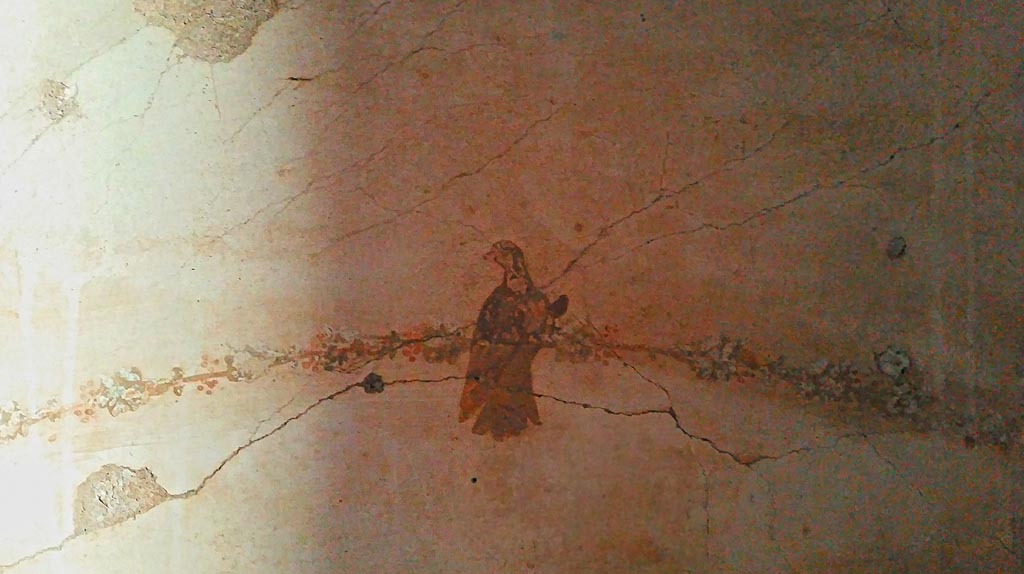 IV.4 Herculaneum. Photo taken between October 2014 and November 2019. 
Room 24, detail of painted bird decoration from east wall above doorway. Photo courtesy of Giuseppe Ciaramella.

