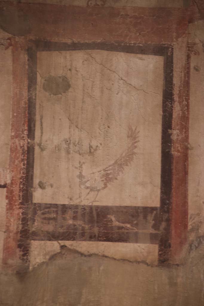IV.11, Herculaneum, September 2021. 
Detail of painting from centre of east wall of triclinium/oecus. Photo courtesy of Klaus Heese.

