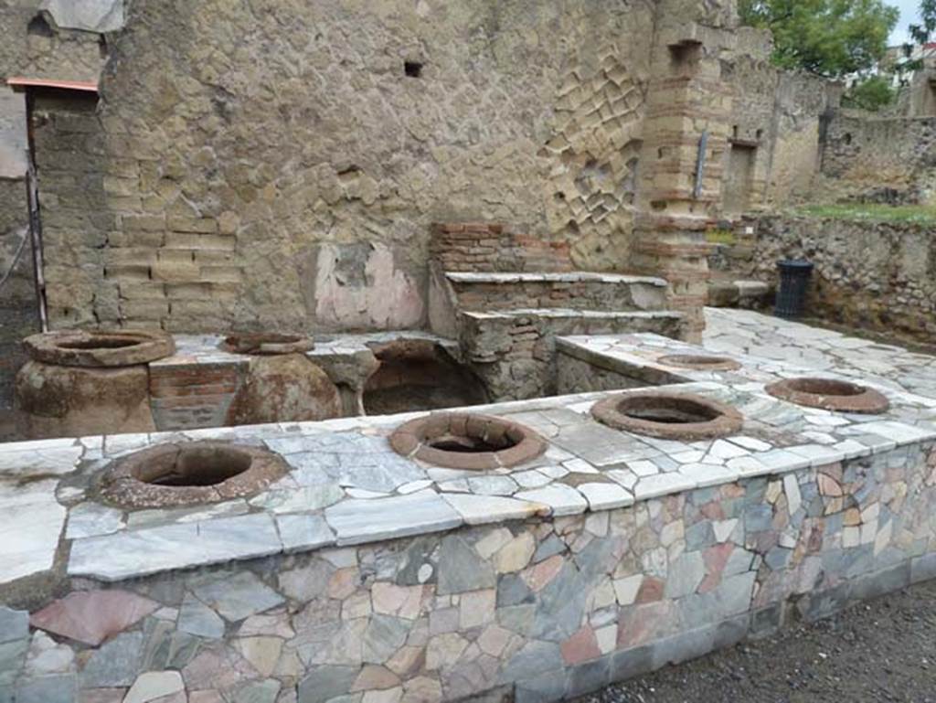 Ins. IV.16 and 15, Herculaneum, September 2015. Looking north-west across bar, from IV.16 towards doorway at IV.15 on Decumanus Inferiore.