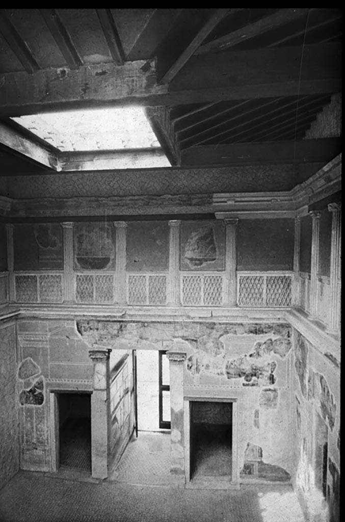 V.1 Herculaneum, The Samnite House. Photo by Theodor Benzinger.
Looking towards west end of atrium, with restored compluvium in roof.
Used with the permission of the Institute of Archaeology, University of Oxford. 
File name INSTARCHbx21im003 Resource ID 37885.
See photo on University of Oxford HEIR database
