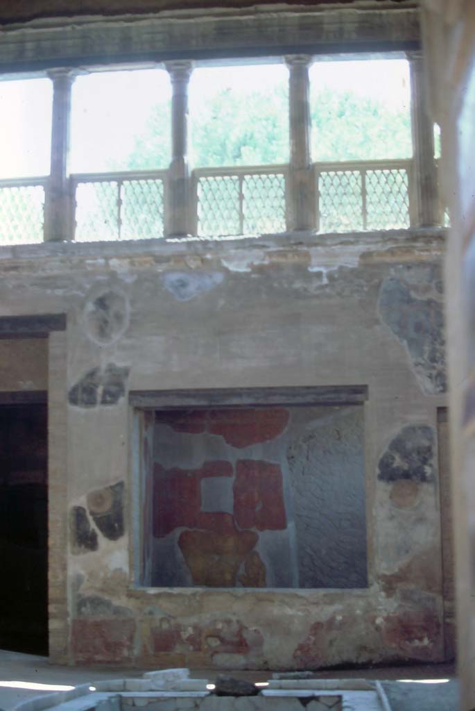 V.1 Herculaneum. 7th August 1976. 
Looking towards the tablinum, room 6, with window on east side of atrium.
Photo courtesy of Rick Bauer, from Dr George Fay’s slides collection.

