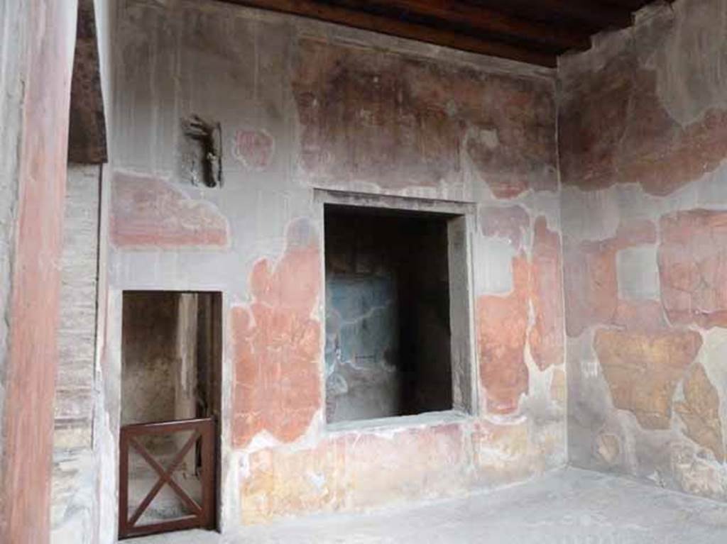 V.1 Herculaneum. May 2010. Room 6, looking towards north wall of tablinum, with window onto another well-decorated room (room 7), and doorway to room 8.