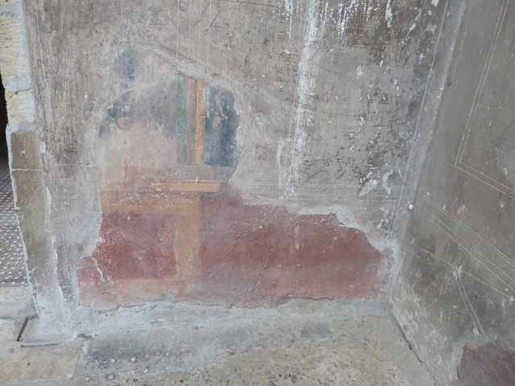 V.1 Herculaneum. May 2010. West wall of atrium, detail of painted zoccolo in north-west corner. 