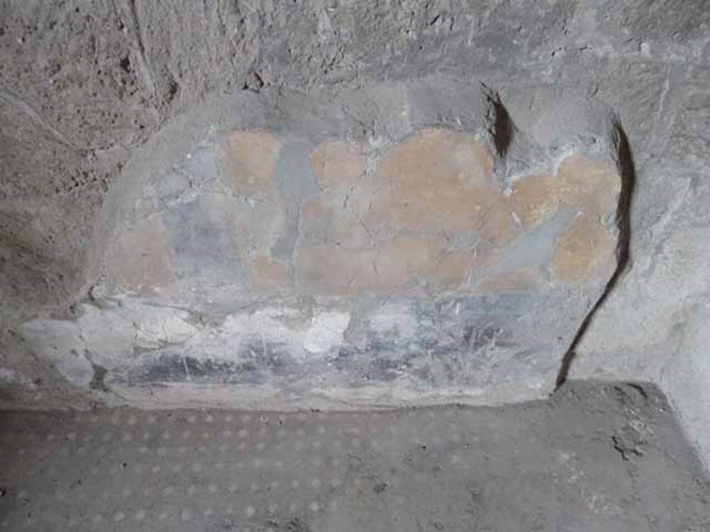 V.1 Herculaneum. May 2010. Room 2, remains of painted zoccolo on north wall.