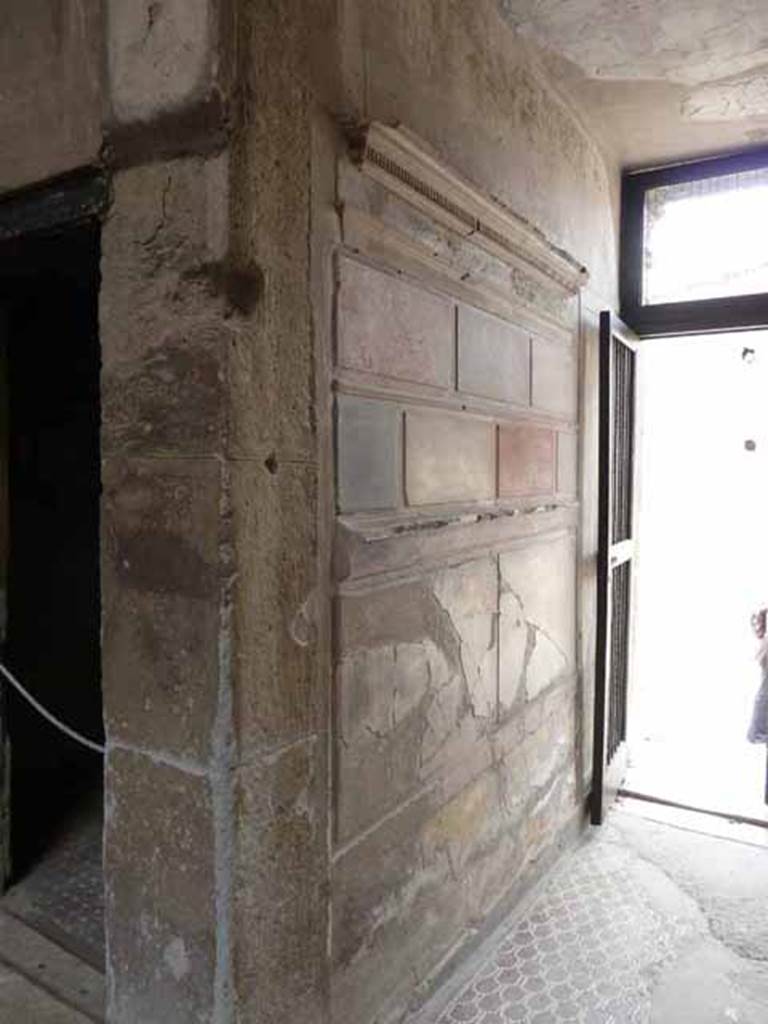V.1 Herculaneum. May 2010. South wall of entrance corridor, and doorway to room 3, looking west from atrium. 

