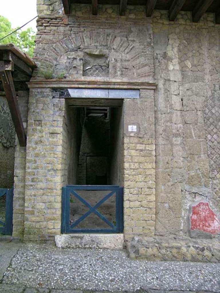 V.2 Herculaneum. May 2005. 
Doorway to steps to upper floor, on east side of Cardo IV Superiore. Photo courtesy of Nicolas Monteix.

