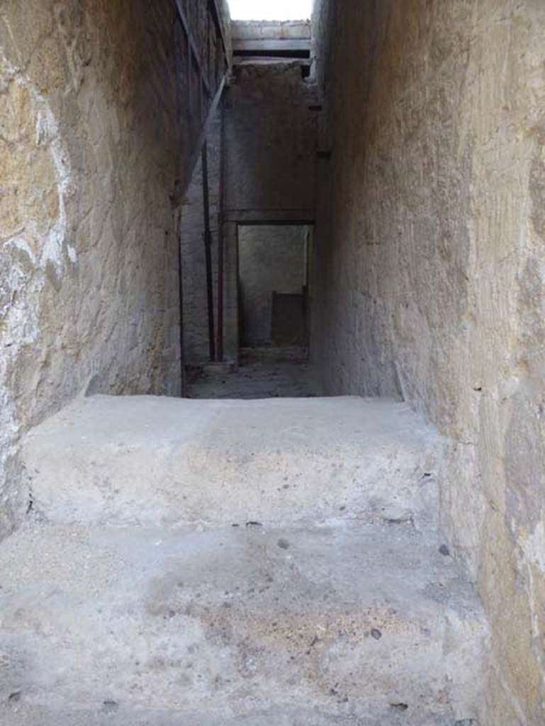 V 2, Herculaneum, October 2014. View from doorway, above stone steps, which would have continued to the upper floor. Photo courtesy of Michael Binns.