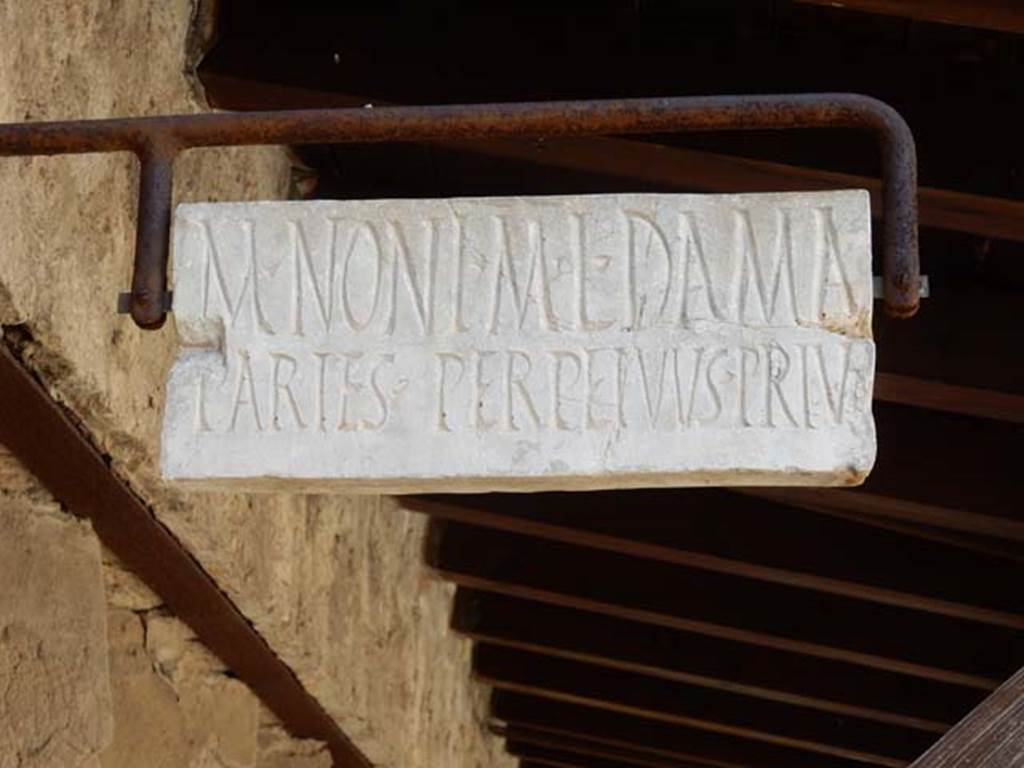 V.4 Herculaneum. May 2018. Marble plaque marking the property boundary of M. NONI M. L. DAMA.
Photo courtesy of Buzz Ferebee.