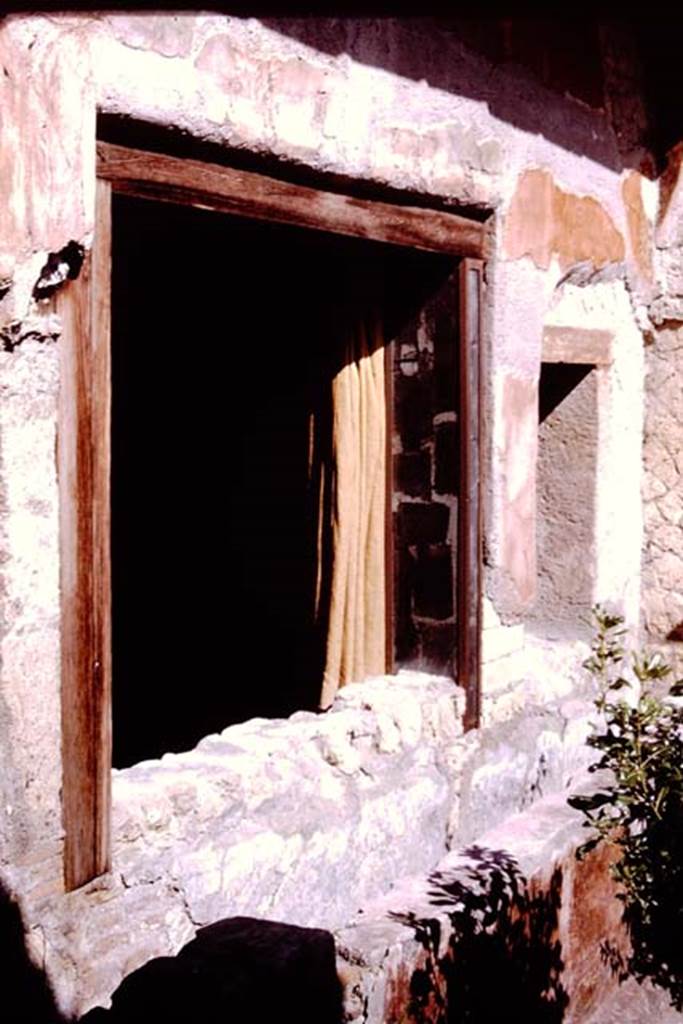Ins. V.5, Herculaneum. 1964. Window on north side of garden.  Photo by Stanley A. Jashemski.
Source: The Wilhelmina and Stanley A. Jashemski archive in the University of Maryland Library, Special Collections (See collection page) and made available under the Creative Commons Attribution-Non Commercial License v.4. See Licence and use details. J64f1172
