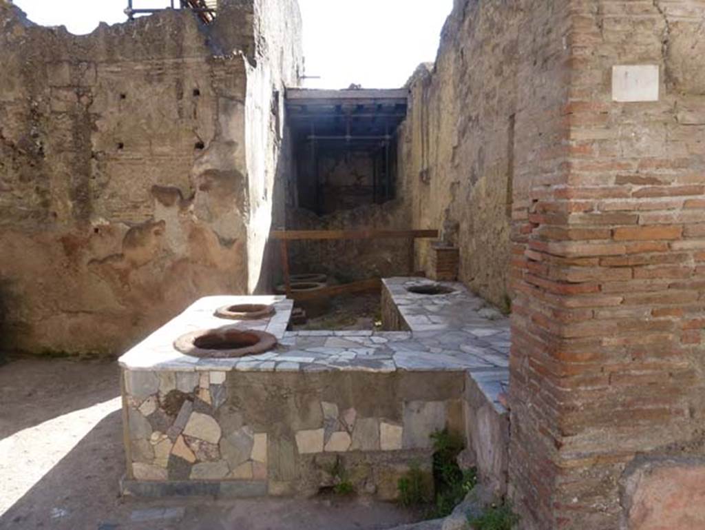 V.10, Herculaneum. June 2012. Looking south across counter in shop-room. Photo courtesy of Michael Binns.
