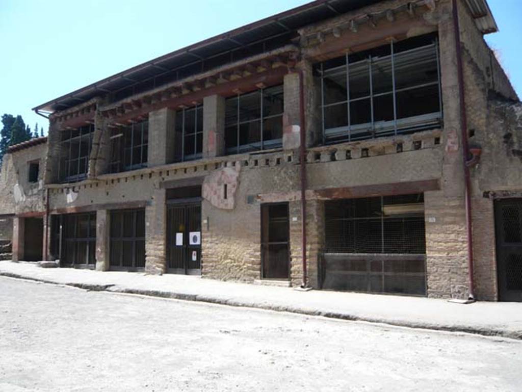 V.15 Herculaneum, August 2013. Looking west from Decumanus Maximus towards insula, with V.15 the doorway in the centre. Photo courtesy of Buzz Ferebee.