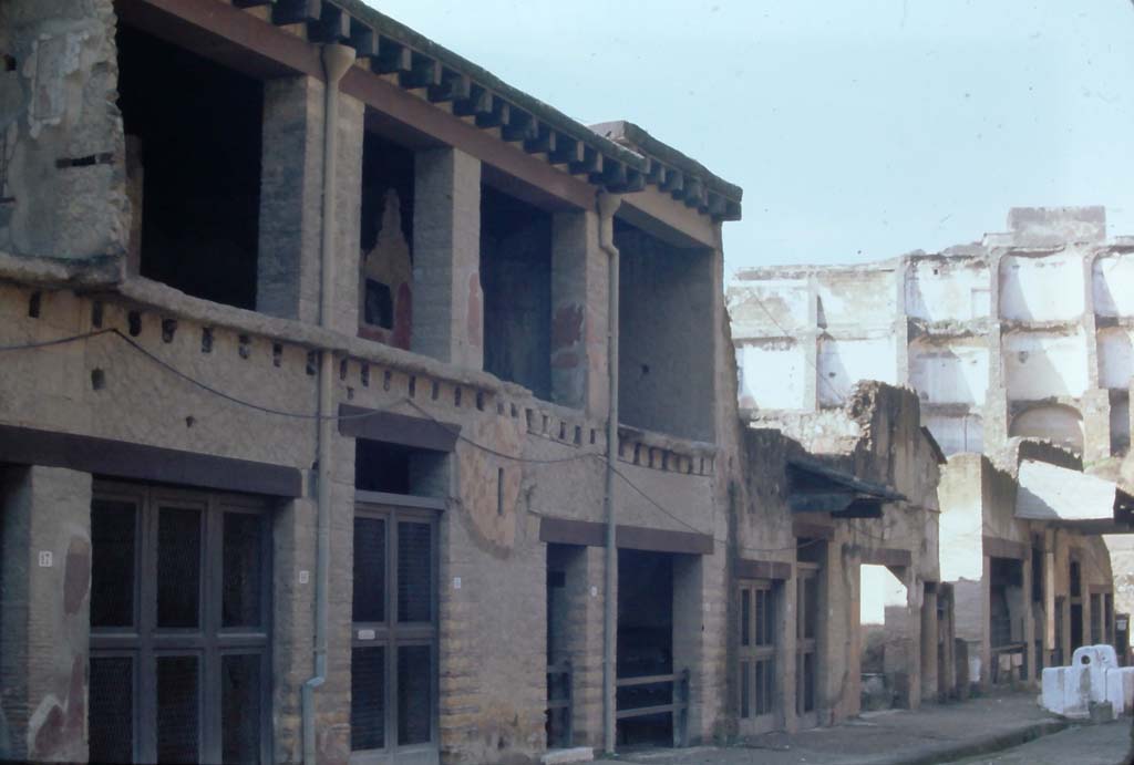 Decumanus Maximus, Herculaneum, 4th December 1971. Entrance doorways to V.17/16/15, Casa del Bicentenario (narrower taller doorway. left of centre), and 14/13.
Looking south-west towards south side of Decumanus Maximus.
Photo courtesy of Rick Bauer, from Dr George Fay’s slides collection.
om Dr George Fay’s slides collection.