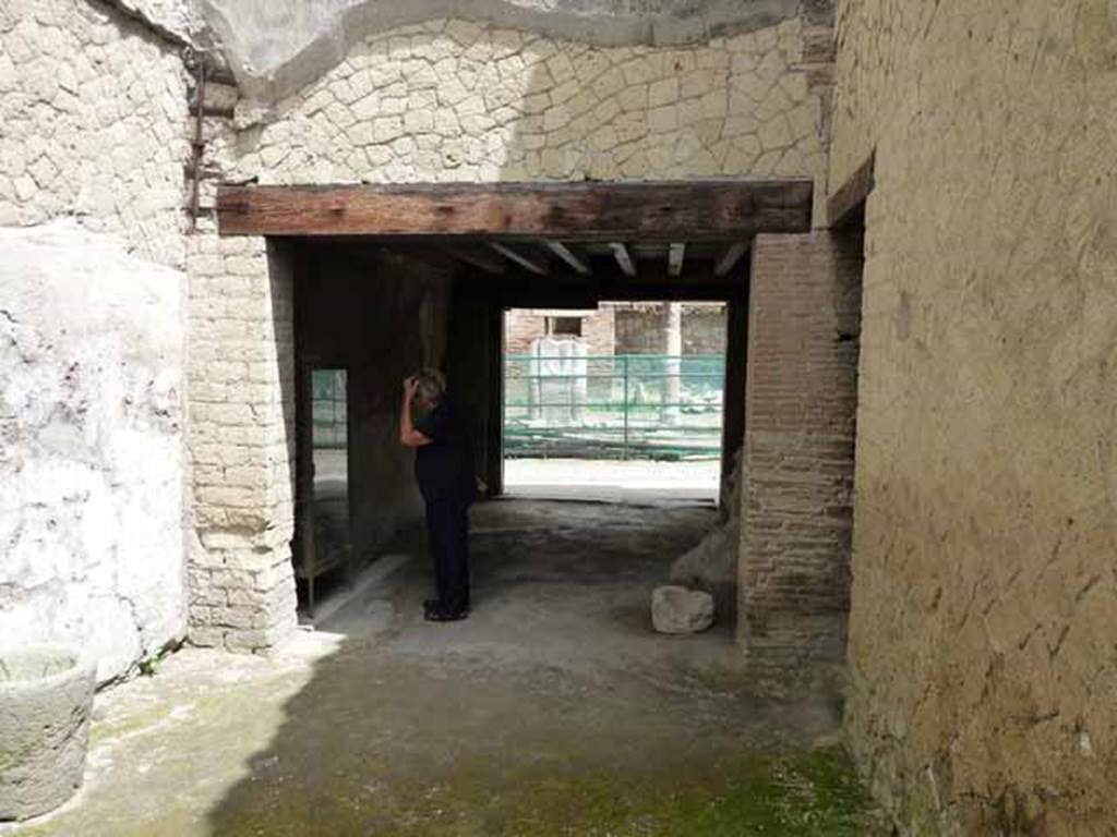 Ins. V, 19. May 2010. Looking north from rear room into shop-room.