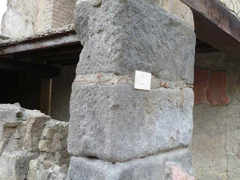 V, 21, Herculaneum. Pilaster between V.21 and V.20 on north-east corner of insula. May 2010.