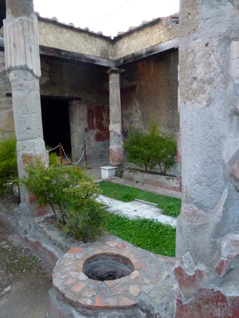 V.30 Herculaneum, October 2012. Looking north-west across atrium from ancient well. Photo courtesy of Michael Binns.