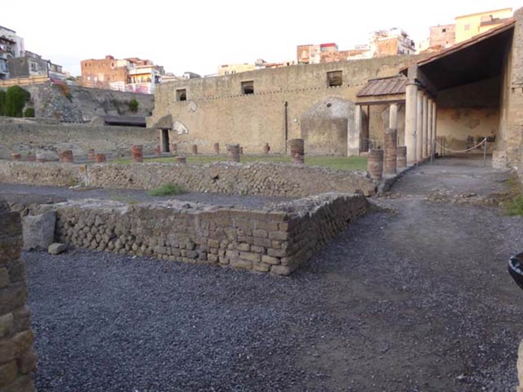 VI.5, Herculaneum. September 2015. Central Baths, doorway leading to open-exercise area, at front of photo. Photo courtesy of Michael Binns.