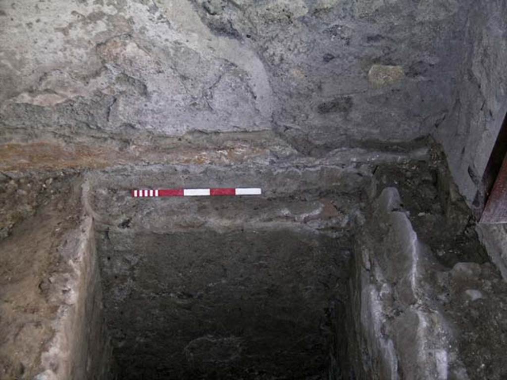 VI.15, Herculaneum. September 2004. 
Excavation in north-west corner, entrance doorway on right, looking west across rectangular pit. .
Photo courtesy of Nicolas Monteix.
