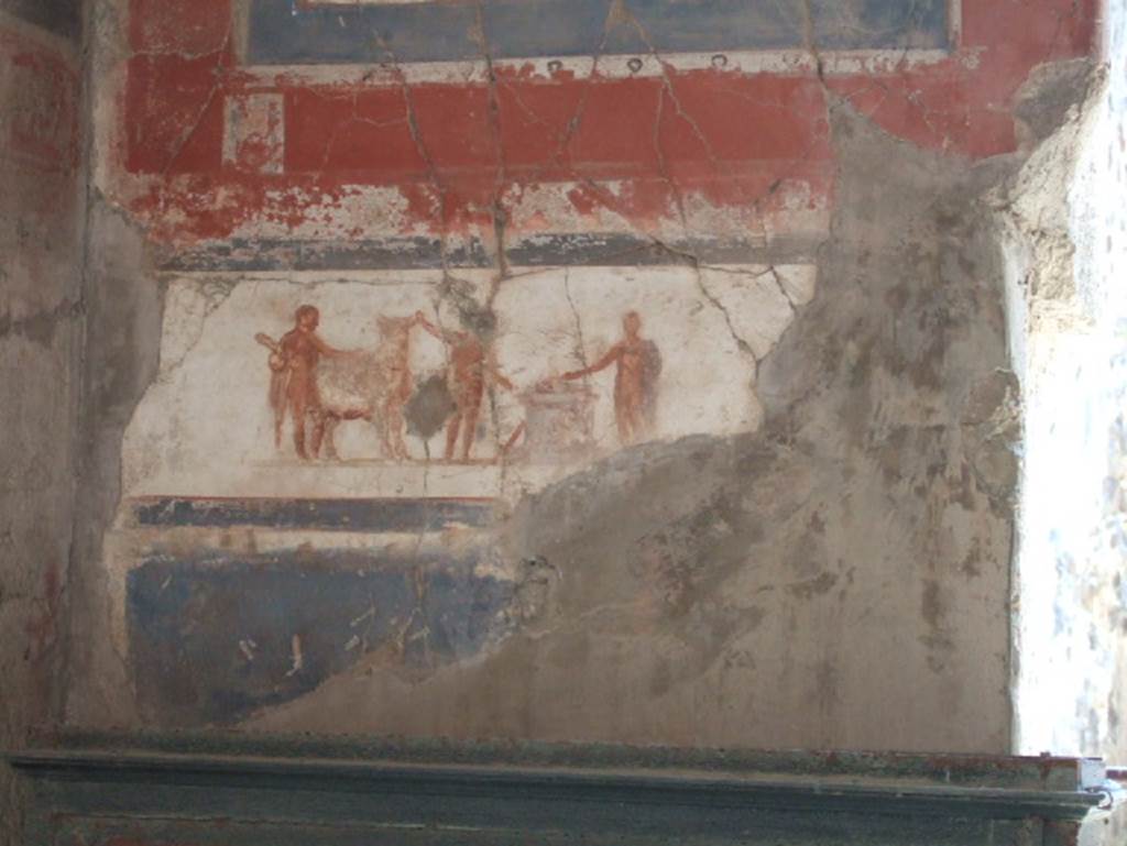 Ins.VI.16, Herculaneum, May 2006. Detail of painted panel in south wall. According to some, this panel shows a sacrificial scene in the presence of Hercules. 
