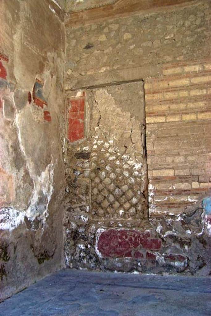 VI.17, Herculaneum. July 2003. South-east corner of tablinum, with blocked window in south wall.
Photo courtesy of Nicolas Monteix.