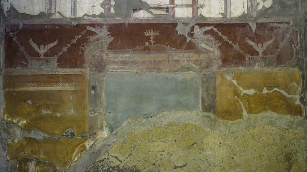 VI.29 Herculaneum. August 2021. Room 7, oecus, detail of painted decoration on north wall. Photo courtesy of Robert Hanson.