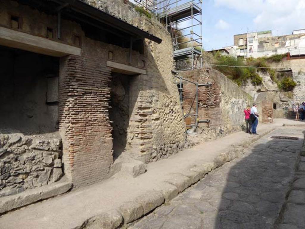 VII.15 Herculaneum, centre right. October 2014. Looking north towards doorways on west side of Cardo III Superiore.
