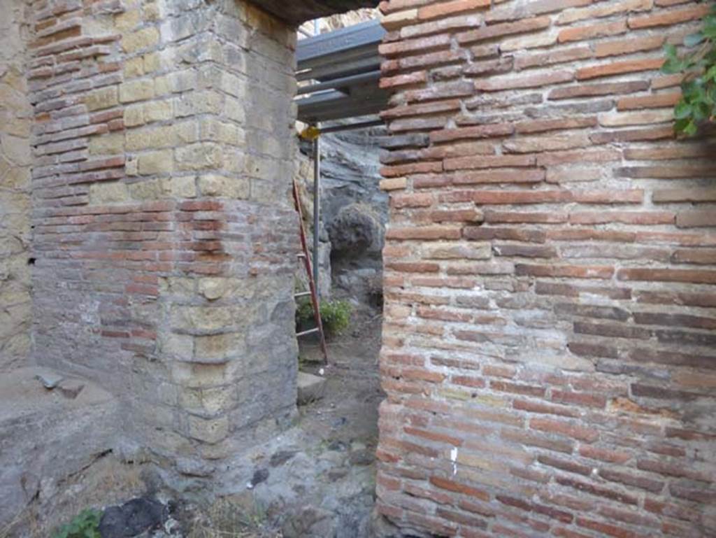 Ins. VII, Herculaneum, September 2015. The Basilica Noniana, doorway in room at southern end.
