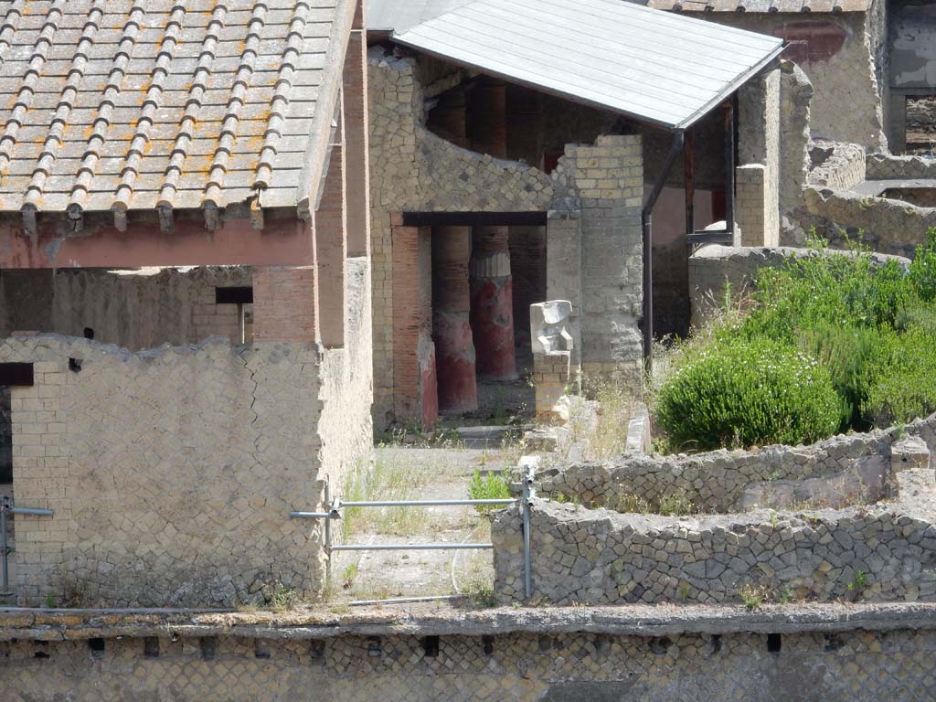 Ins. Orientalis I, 1, Herculaneum, June 2019. 
Looking north across loggia, now fallen, towards doorway to corridor leading to atrium, with garden area on right. Photo courtesy of Buzz Ferebee.

