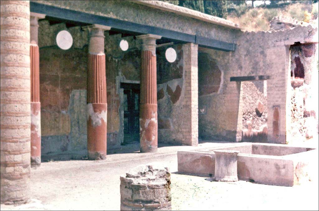 Ins. Or.I.2, Herculaneum, June 1962. Looking north-east across impluvium in atrium.
Photo by Brian Philp: Pictorial Colour Slides, forwarded by Peter Woods
(H42.9 Herculaneum House of the Relief of Telephus)

