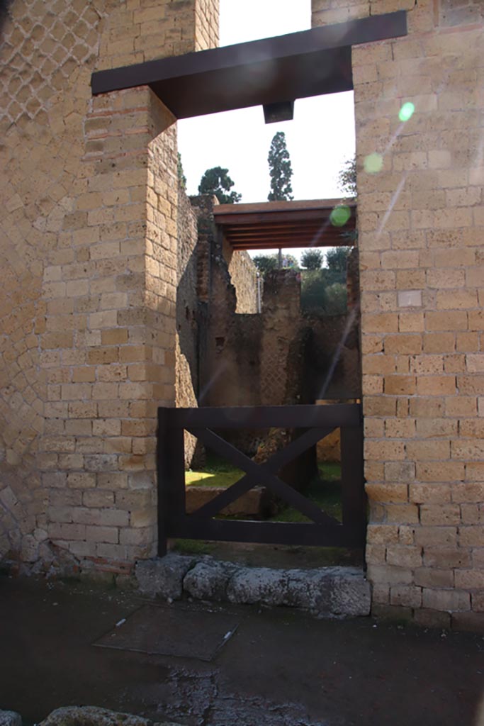 Ins. Orientalis II.7, Herculaneum. October 2022. 
Looking east through entrance doorway. Photo courtesy of Klaus Heese.
