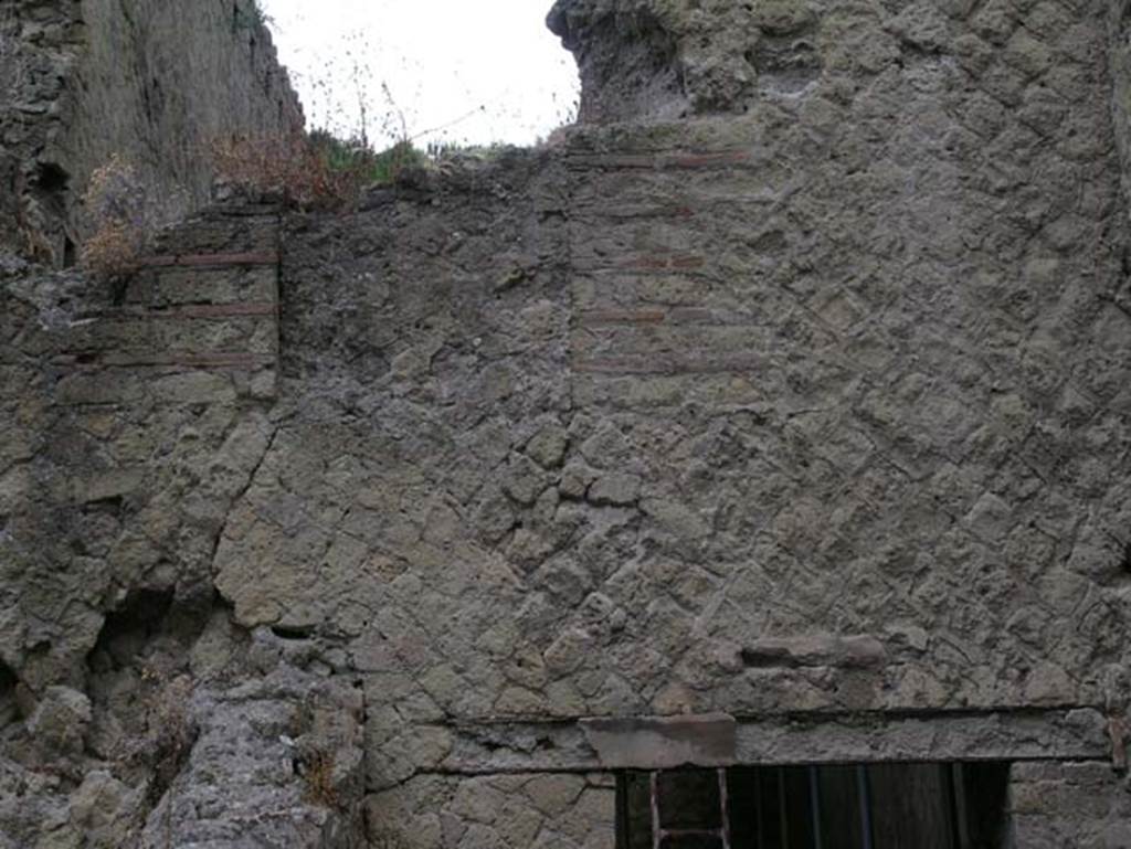 Ins Or II, 7, Herculaneum. June 2006.  
Detail above doorway in west wall of a room, reached by Ins.Or.II.7, but which may be part of the rooms of the Palaestra at Ins.Or.II.4 (room C).
Photo courtesy of Nicolas Monteix.
