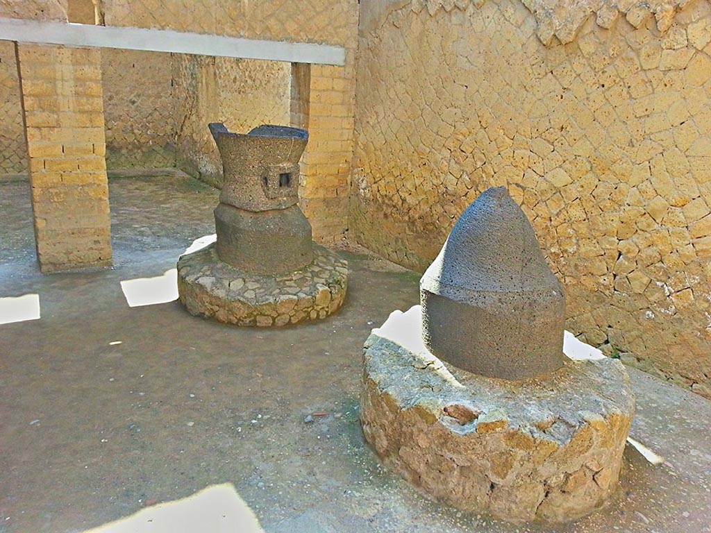 Ins. Or. II.8, Herculaneum, photo taken between October 2014 and November 2019. 
Detail of mills in bakery. Photo courtesy of Giuseppe Ciaramella.
