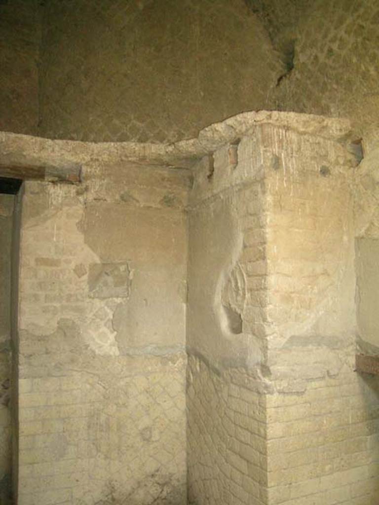 Ins Or II, 8, Herculaneum. December 2004. 
Room on the north side of room with oven, east wall, on left. 
Embedded in this wall used to be a terracotta panel showing the stucco phalli. 
Photo courtesy of Nicolas Monteix.
